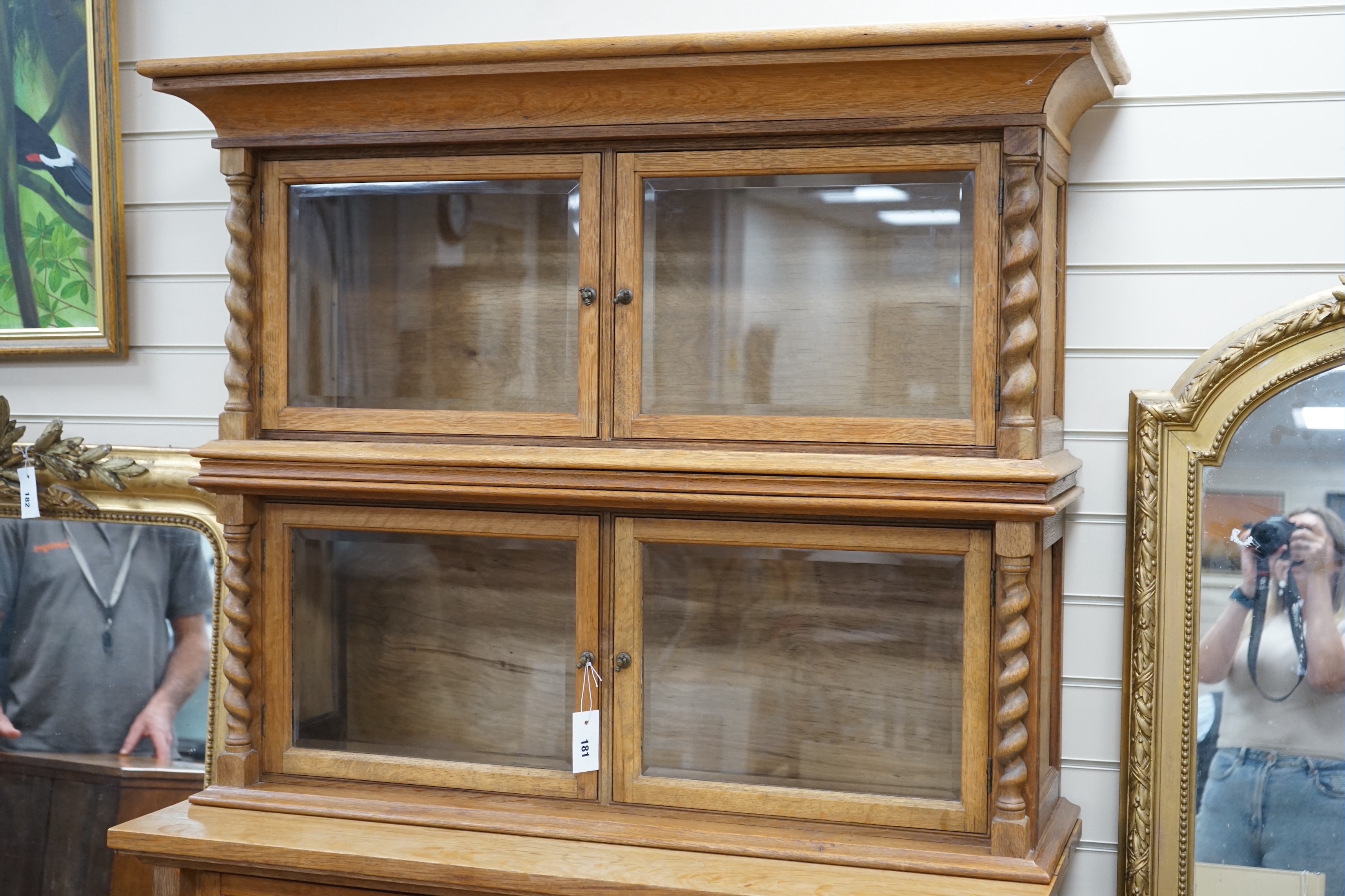 An early 20th century oak three part side cabinet, width 105cm, depth 47cm, height 188cm